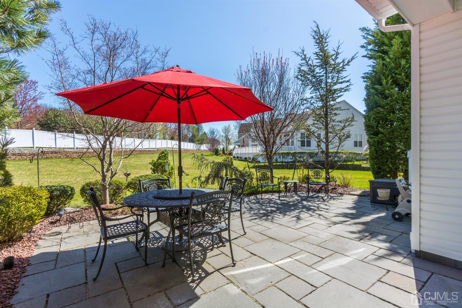 28 Kings Mill Road Monroe Township, NJ 08831 - Photo 39 of 42 an outdoor space with furniture and umbrella