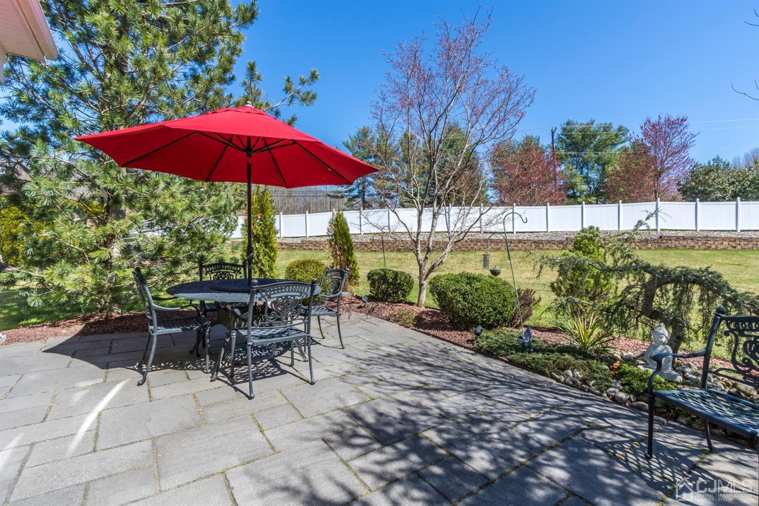 28 Kings Mill Road Monroe Township, NJ 08831 - Photo 40 of 42 a view of a backyard with a patio and garden