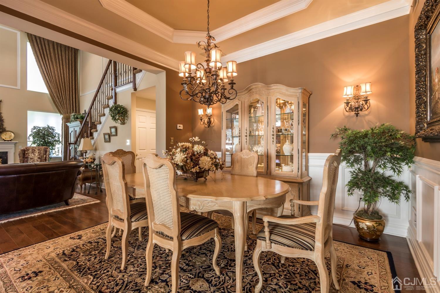 28 Kings Mill Road Monroe Township, NJ 08831 - Photo 7 of 42 a view of a dining room with furniture and chandelier