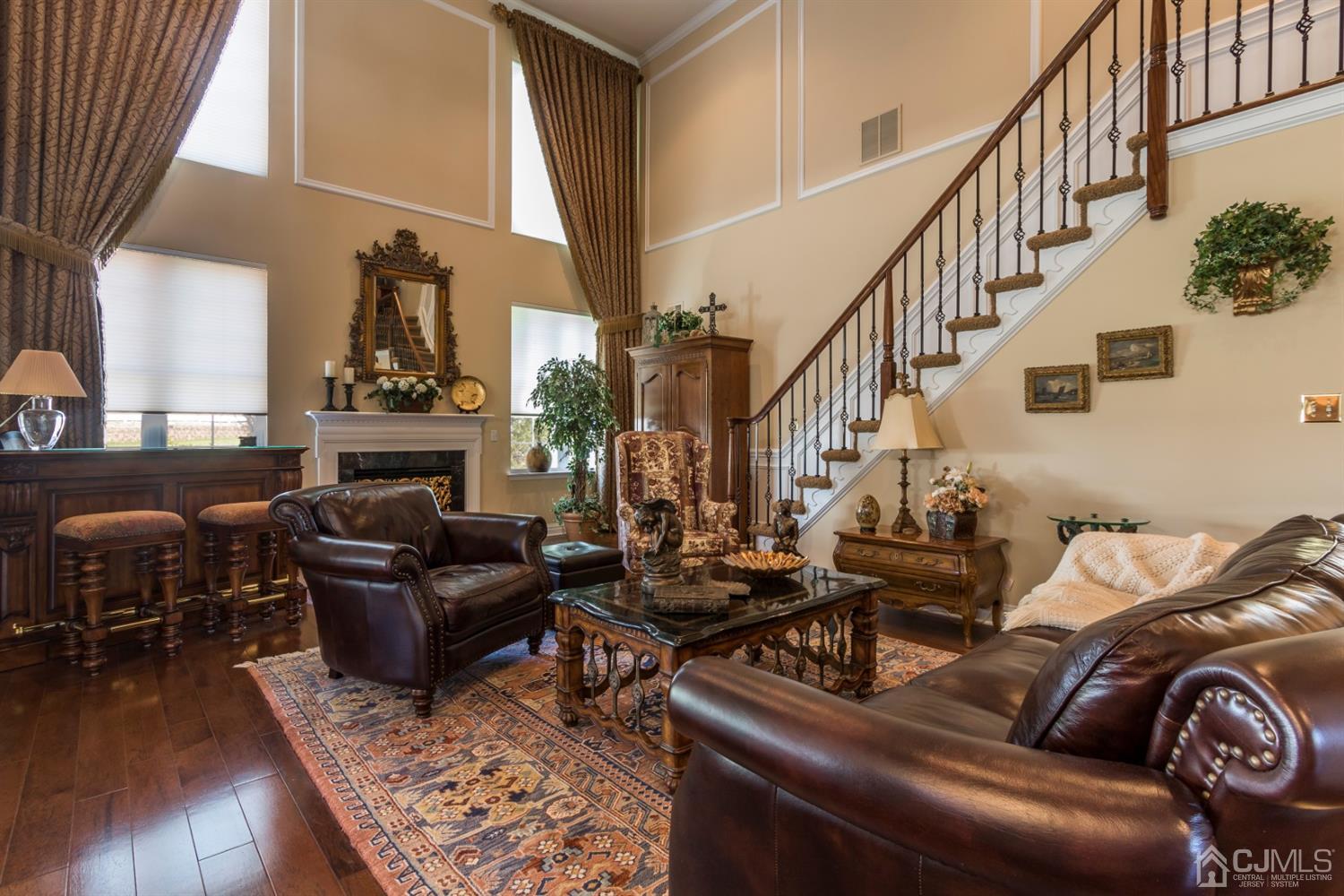 28 Kings Mill Road Monroe Township, NJ 08831 - Photo 10 of 42 a living room with fireplace furniture and a wooden floor