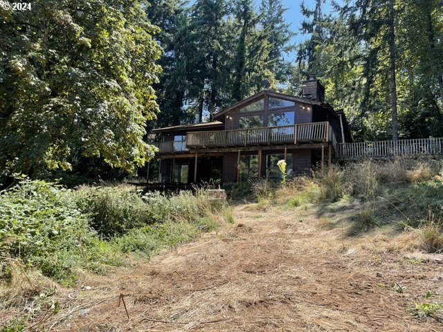 10909 South Ridgetop Drive Molalla, OR 97038 - Photo 1 of 28 a backyard of a house with lots of green space