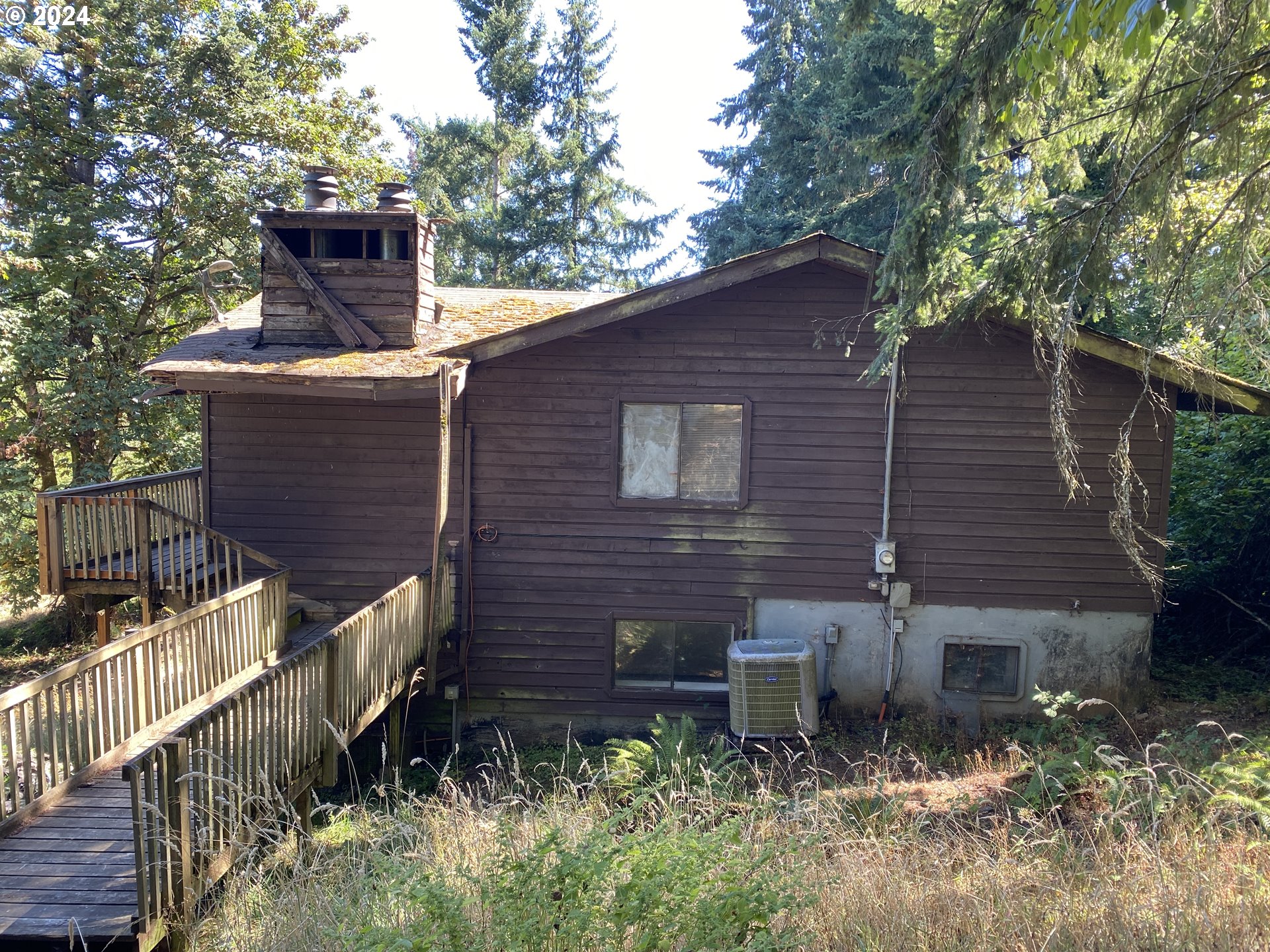10909 South Ridgetop Drive Molalla, OR 97038 - Photo 2 of 28 a brick house with trees in front of it