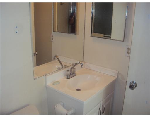 7331 Northwest 18th Street, Unit 204 Margate, FL 33063 - Photo 11 of 15 a bathroom with a sink and a mirror