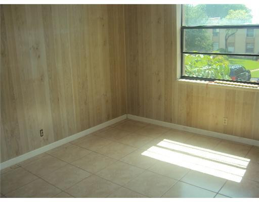 7331 Northwest 18th Street, Unit 204 Margate, FL 33063 - Photo 13 of 15 a view of empty room with a window