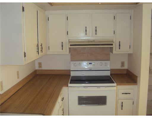 7331 Northwest 18th Street, Unit 204 Margate, FL 33063 - Photo 4 of 15 a stove top oven sitting inside of a kitchen