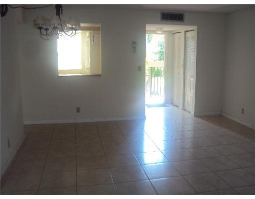 7331 Northwest 18th Street, Unit 204 Margate, FL 33063 - Photo 8 of 15 a view of a hallway with windows