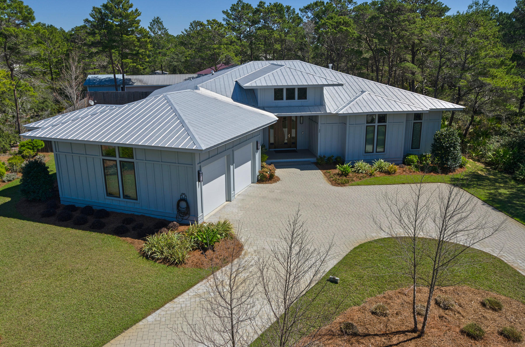 32 Joan Circle Santa Rosa Beach, FL 32459 - Photo 1 of 71 a front view of a house with garden