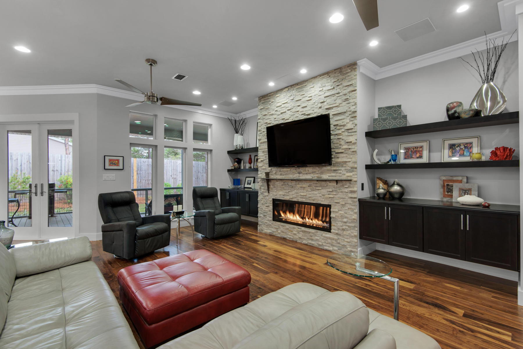 32 Joan Circle Santa Rosa Beach, FL 32459 - Photo 19 of 71 a living room with furniture a fireplace and a flat screen tv