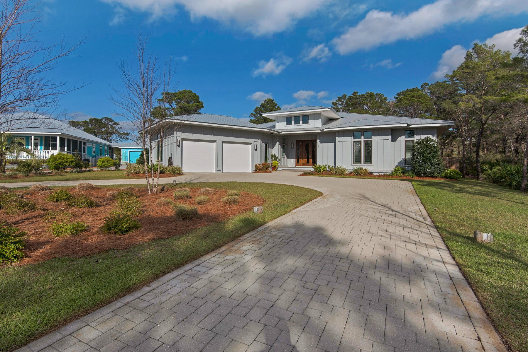 32 Joan Circle Santa Rosa Beach, FL 32459 - Photo 6 of 71 a front view of a house with a garden