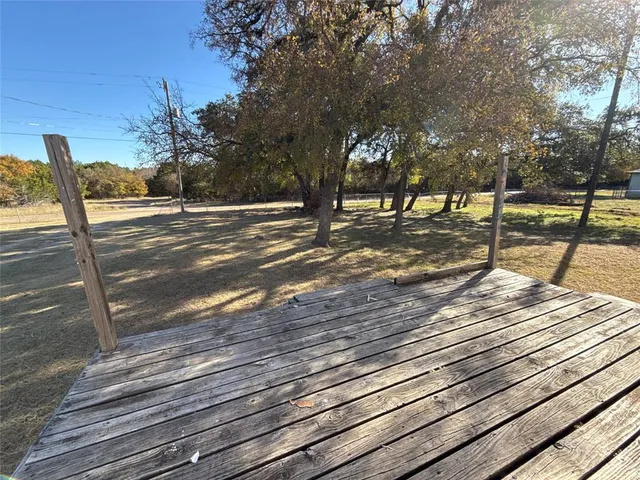 a view of a street with benches