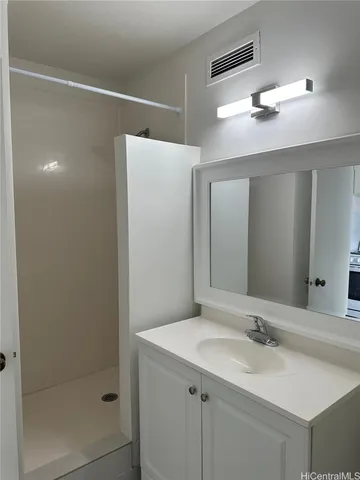a bathroom with a sink and mirror