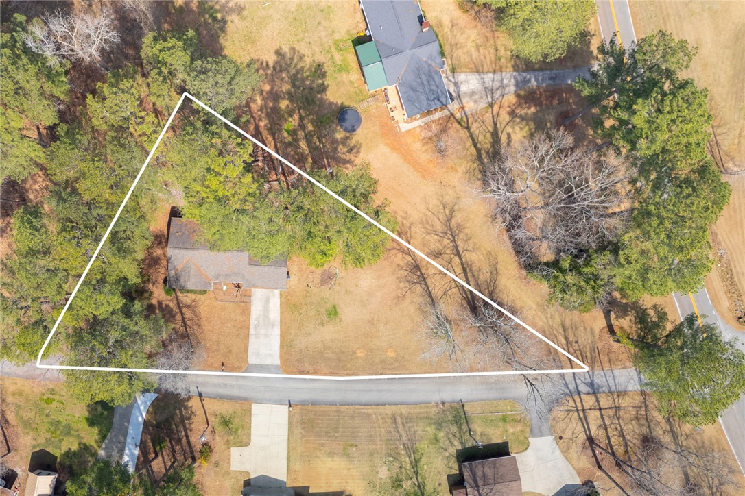 308 Wildwood Road Walhalla, SC 29691 - Photo 22 of 23 This aerial view showcases a residential lot with mature trees and a private driveway.