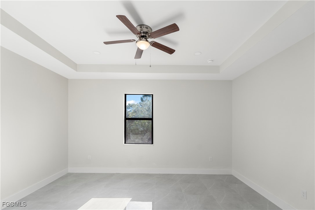 4545-4547 28th Street Southwest Lehigh Acres, FL 33973 - Photo 17 of 38 an empty room with a window and a fan