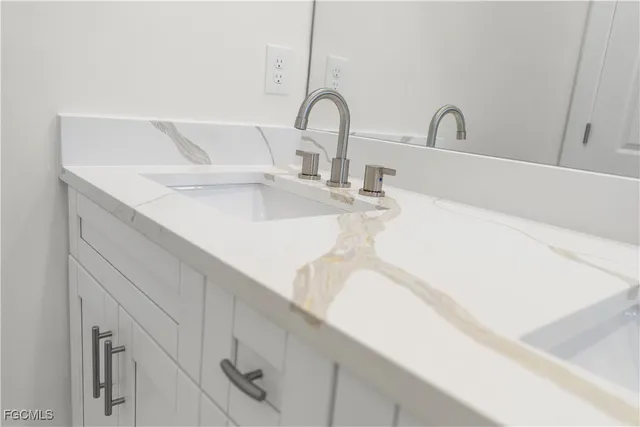 a bathroom with a sink a toilet and bathtub