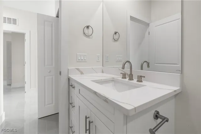 a view of a livingroom with a ceiling fan and window