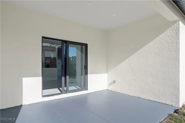 a view of an empty room with a garage