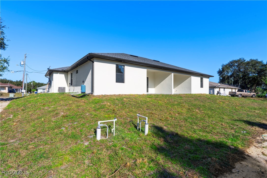 4545-4547 28th Street Southwest Lehigh Acres, FL 33973 - Photo 8 of 38 a house view with a garden space