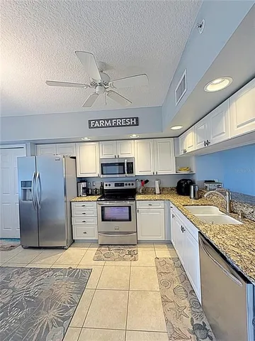 a bathroom with a shower curtain and a sink