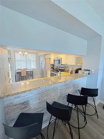 a view of a swimming pool with a lounge chairs