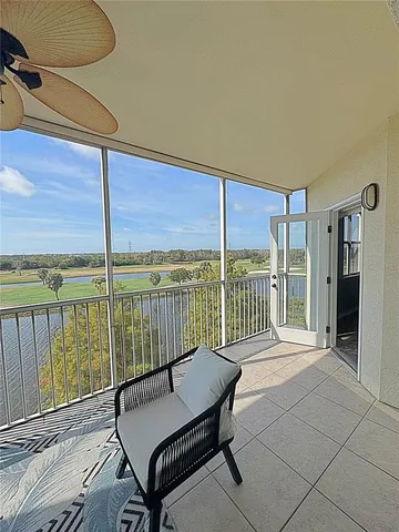 a open kitchen with stainless steel appliances granite countertop a dining table and chairs