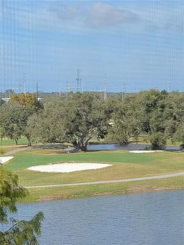 a kitchen with granite countertop stainless steel appliances a stove a sink and a refrigerator