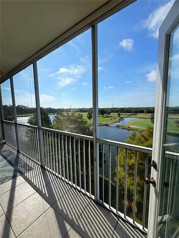 a living room with furniture a rug and a flat screen tv