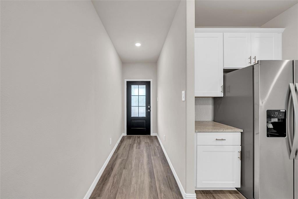 417 Martell Road Lowry Crossing, TX 75069 - Photo 7 of 29 a view of hallway with washer and dryer