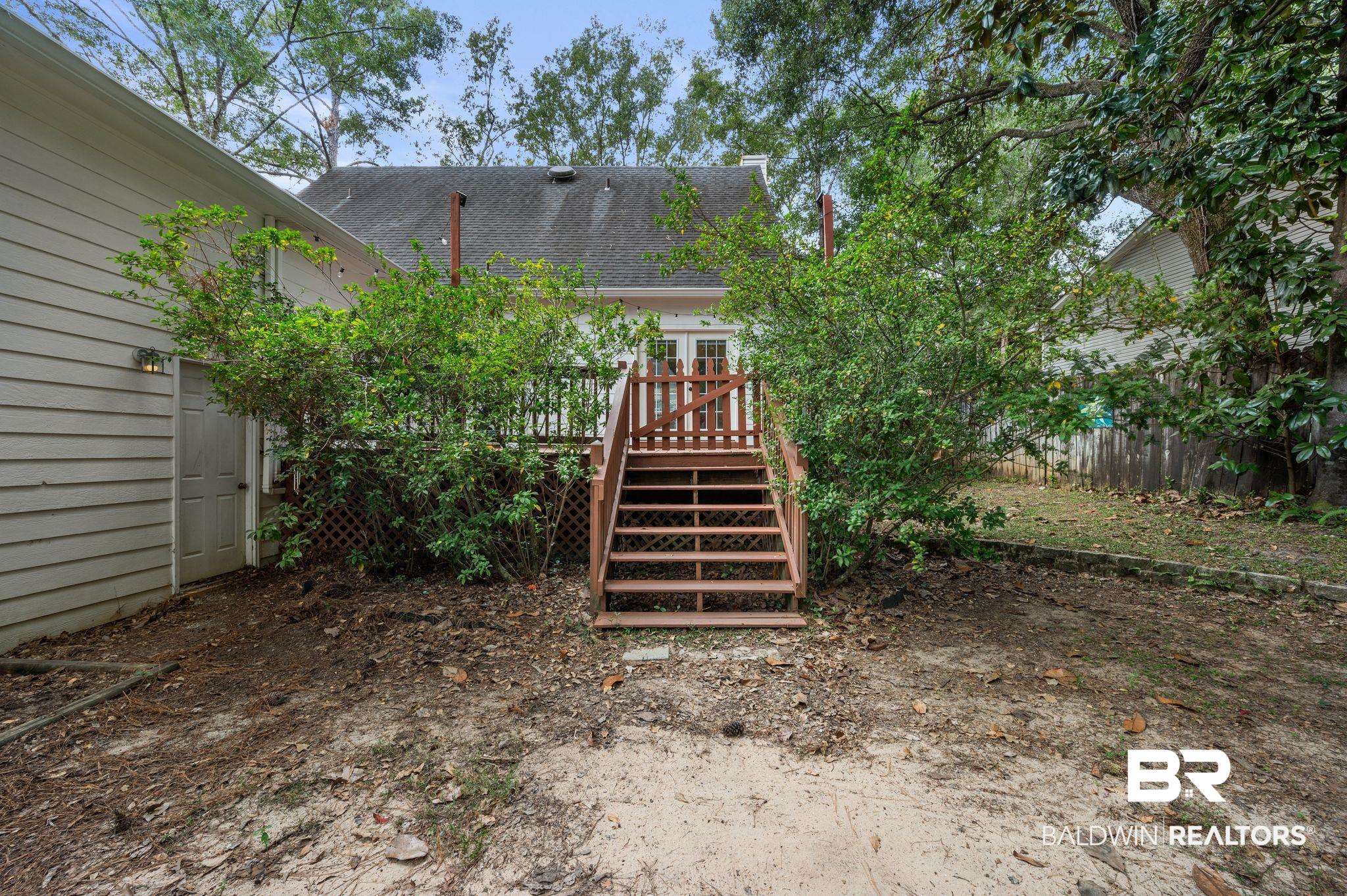 100 Montclair Loop Daphne, AL 36526 - Photo 7 of 39 View of yard with a deck