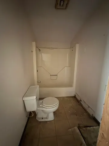 a view of large yard with large trees