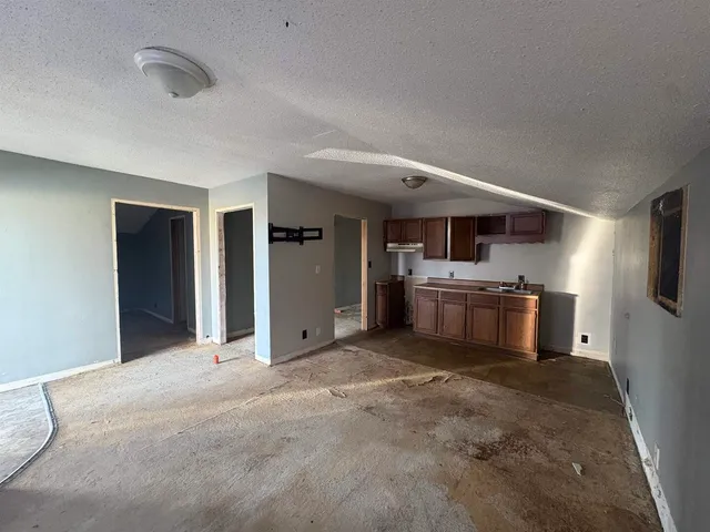 a view of a kitchen with a sink