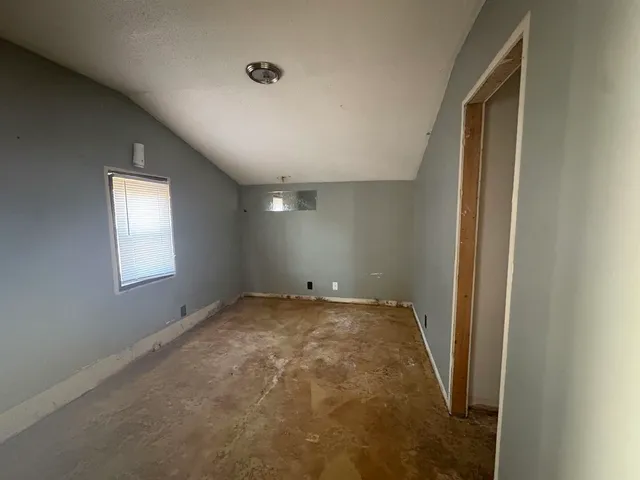 an empty room with windows