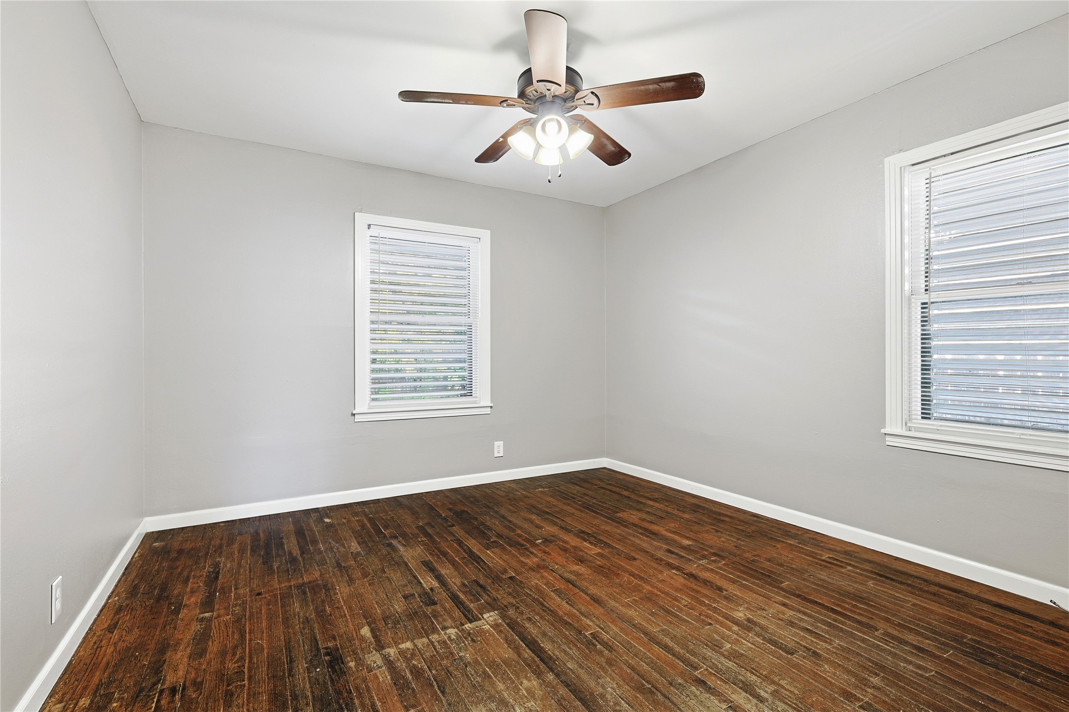106 Trout Avenue Galveston, TX 77550 - Photo 16 of 21 a view of an empty room with wooden floor and a window