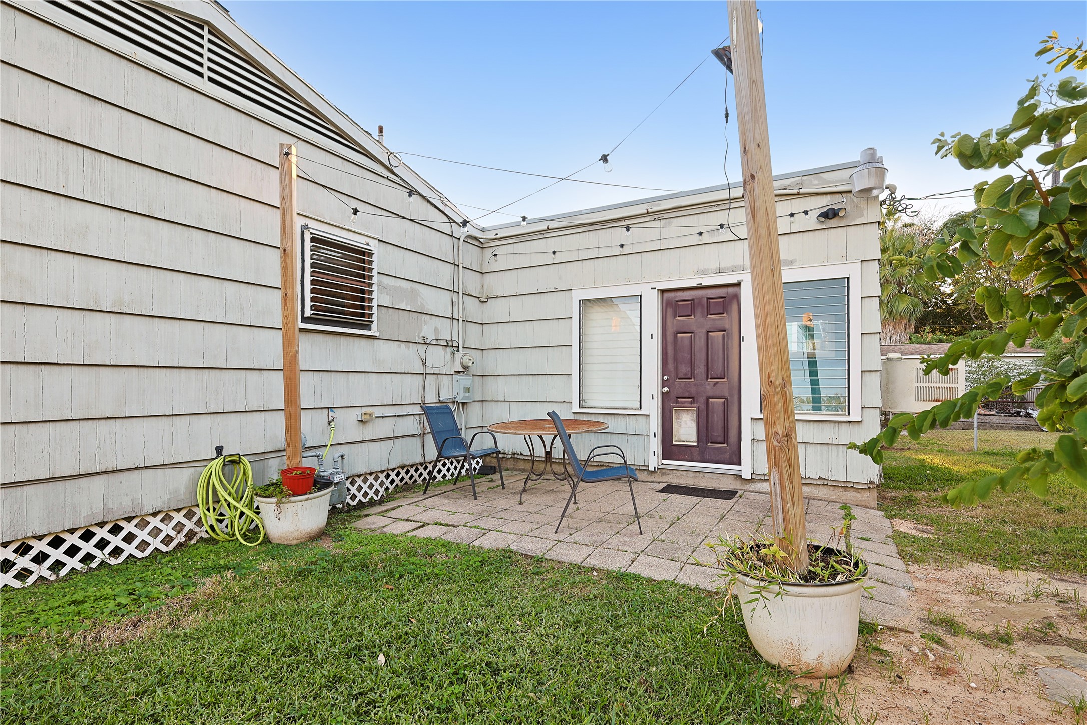 106 Trout Avenue Galveston, TX 77550 - Photo 17 of 21 a front view of a house with a garden