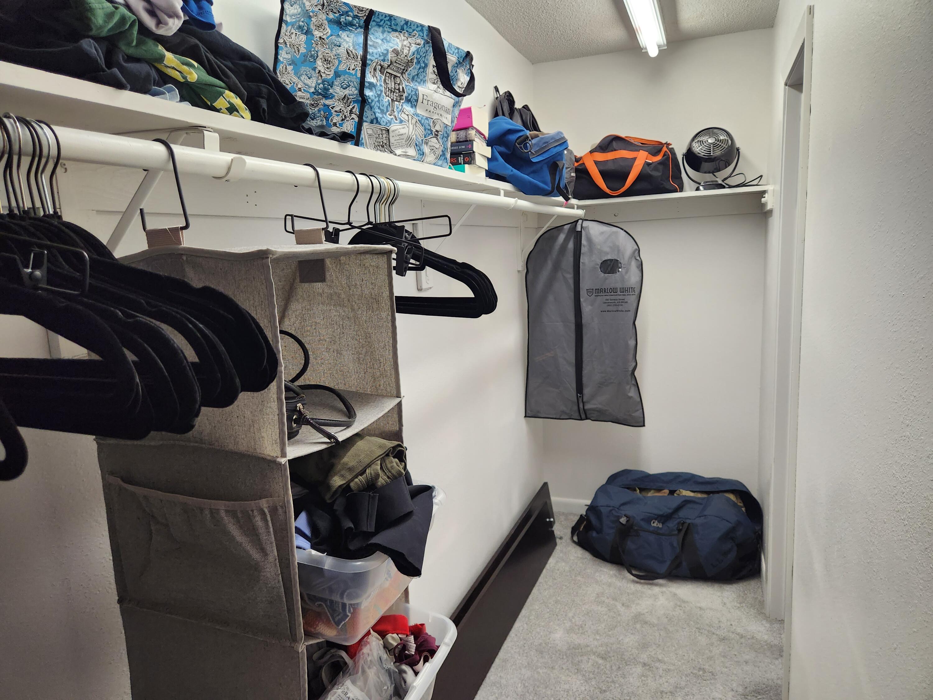 205 Marquette Avenue, Unit 1 Niceville, FL 32578 - Photo 15 of 16 a bedroom with a bed and closet