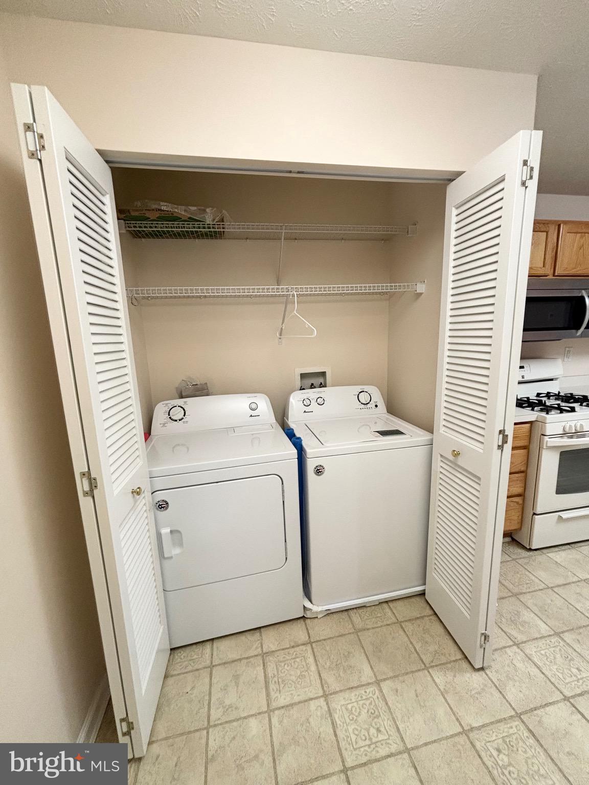 5014 Marchwood Court, Unit 7F Perry Hall, MD 21128 - Photo 16 of 16 a utility room with dryer and washer