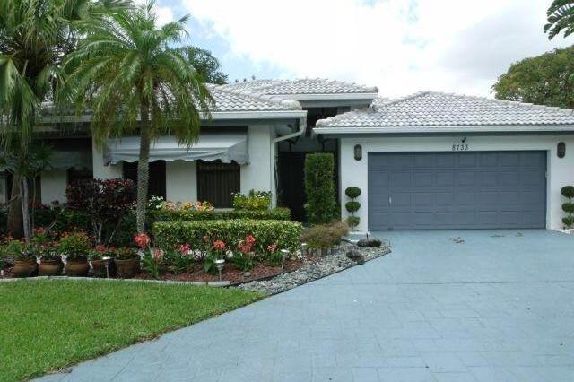 8733 Northwest 83rd Street Tamarac, FL 33321 - Photo 1 of 23 Exterior Front