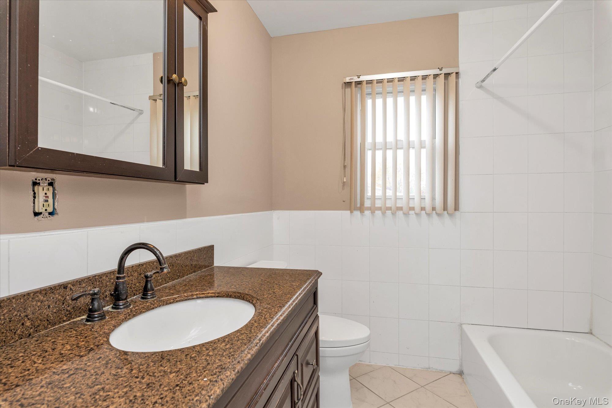49 Prospect Street Roosevelt, NY 11575 - Photo 13 of 21 Bathroom on upper level