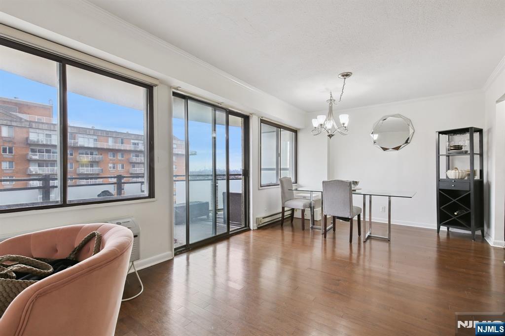 125 Prospect Avenue, Unit 17G Hackensack, NJ 07601 - Photo 17 of 30 a living room with furniture and a large window