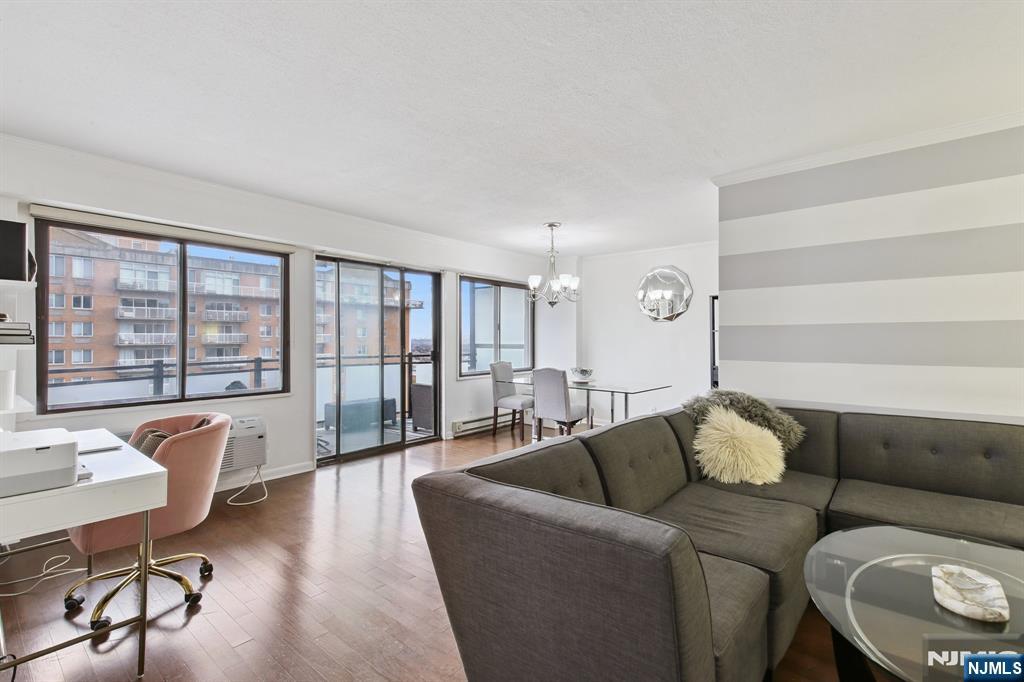 125 Prospect Avenue, Unit 17G Hackensack, NJ 07601 - Photo 29 of 30 a living room with furniture and a large window