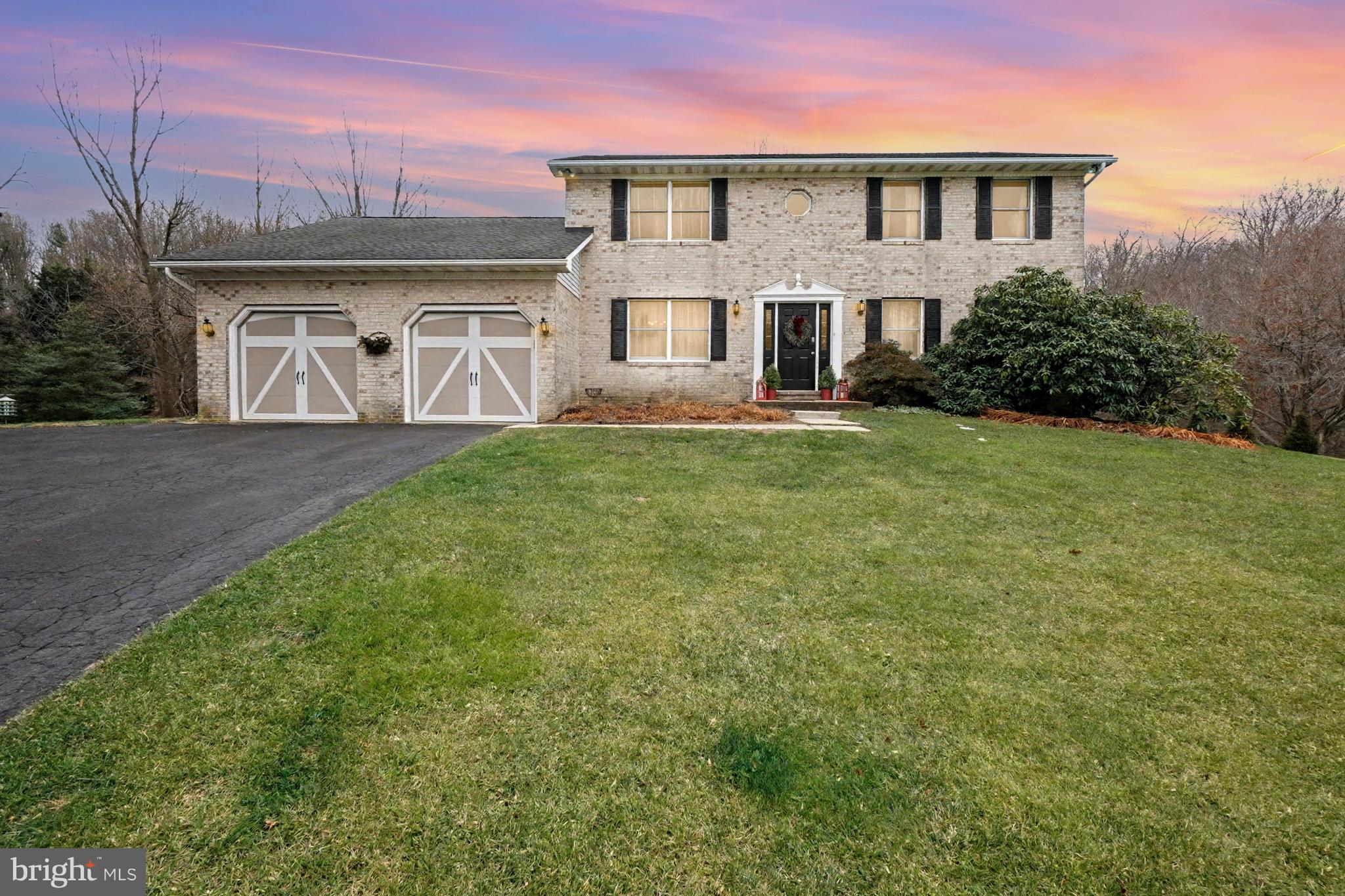 3204 Newfane Court Baldwin, MD 21013 - Photo 1 of 1 a front view of a house with a garden