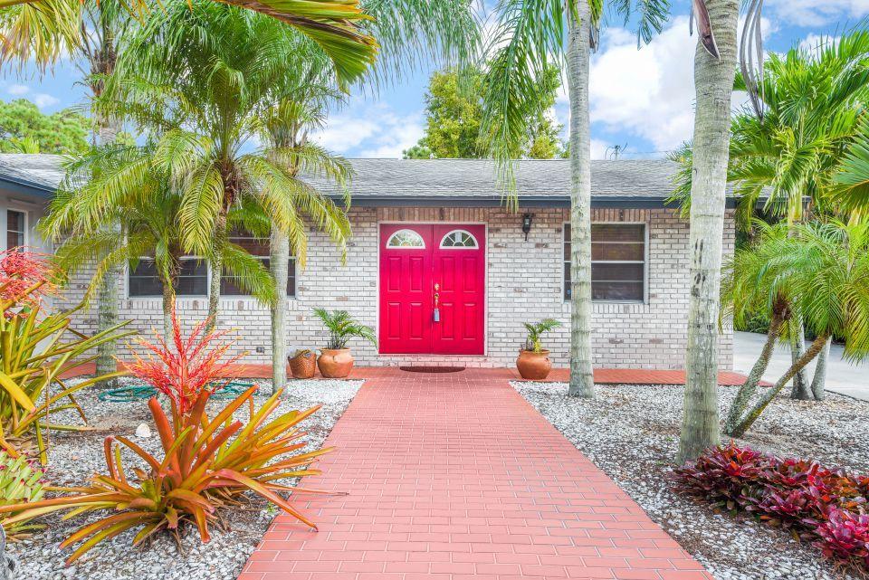 3196 Gulfstream Road Palm Springs, FL 33461 - Photo 1 of 26 a view of a backyard with a patio