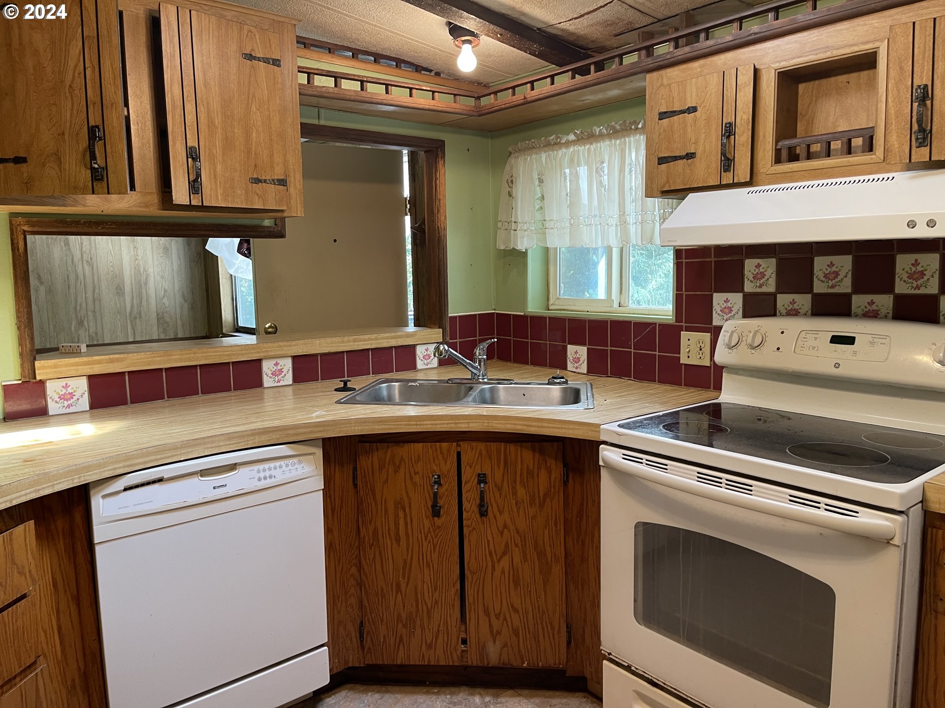 58525 Southwest Hebo Road Grand Ronde, OR 97347 - Photo 3 of 17 a kitchen with a sink and cabinets