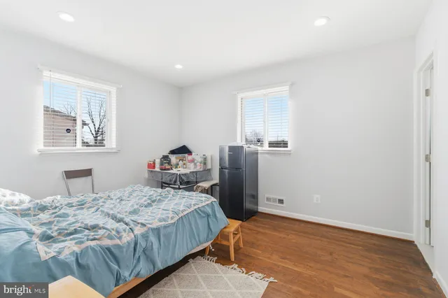 a bedroom with a bed and a closet