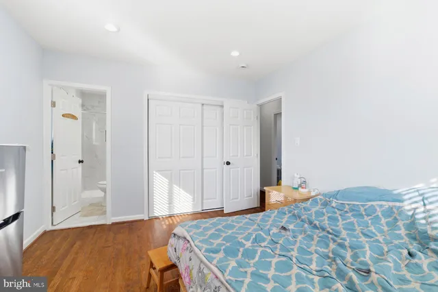 a bedroom with a bed and a cabinets