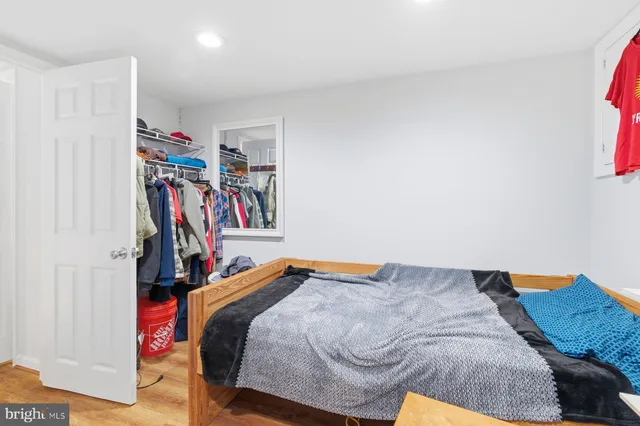 a bedroom with a bed and a closet