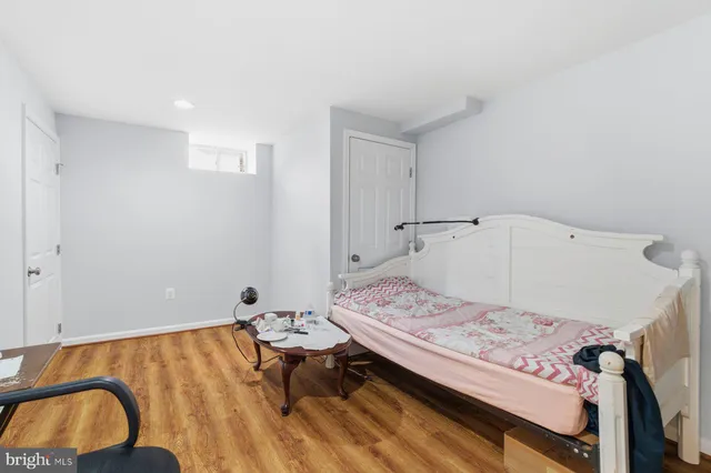a bedroom with a bed and a chair