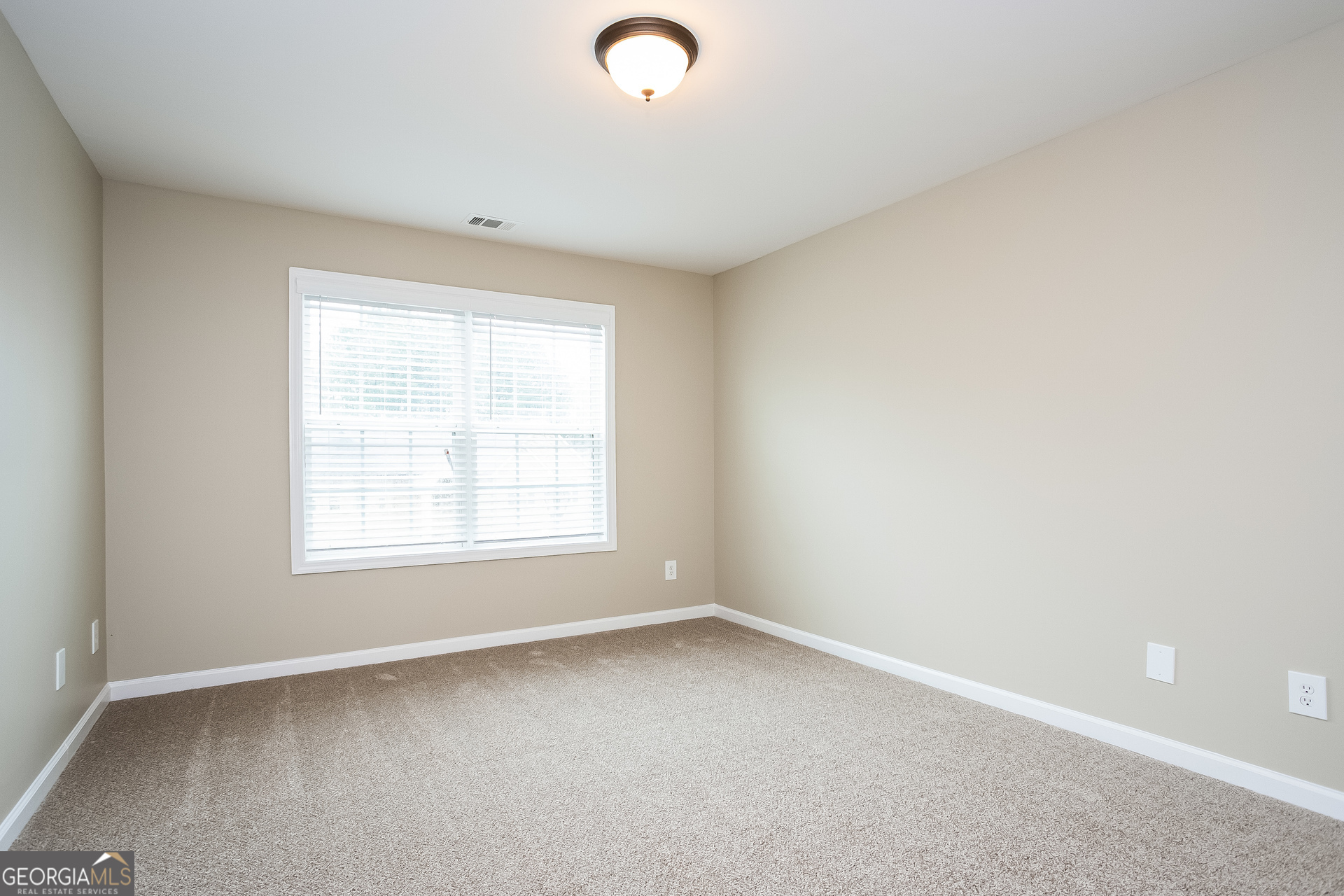 2729 Palmview Court Southwest Atlanta, GA 30331 - Photo 9 of 15 an empty room with a window