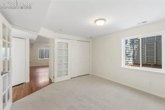 wooden floor and windows in an empty room