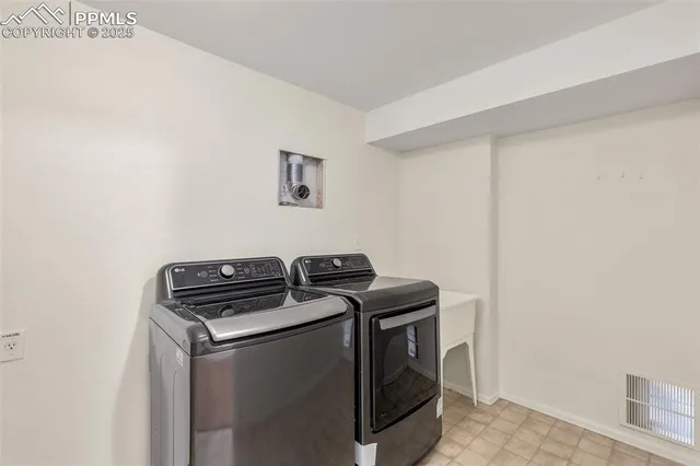 a utility room with washer and dryer