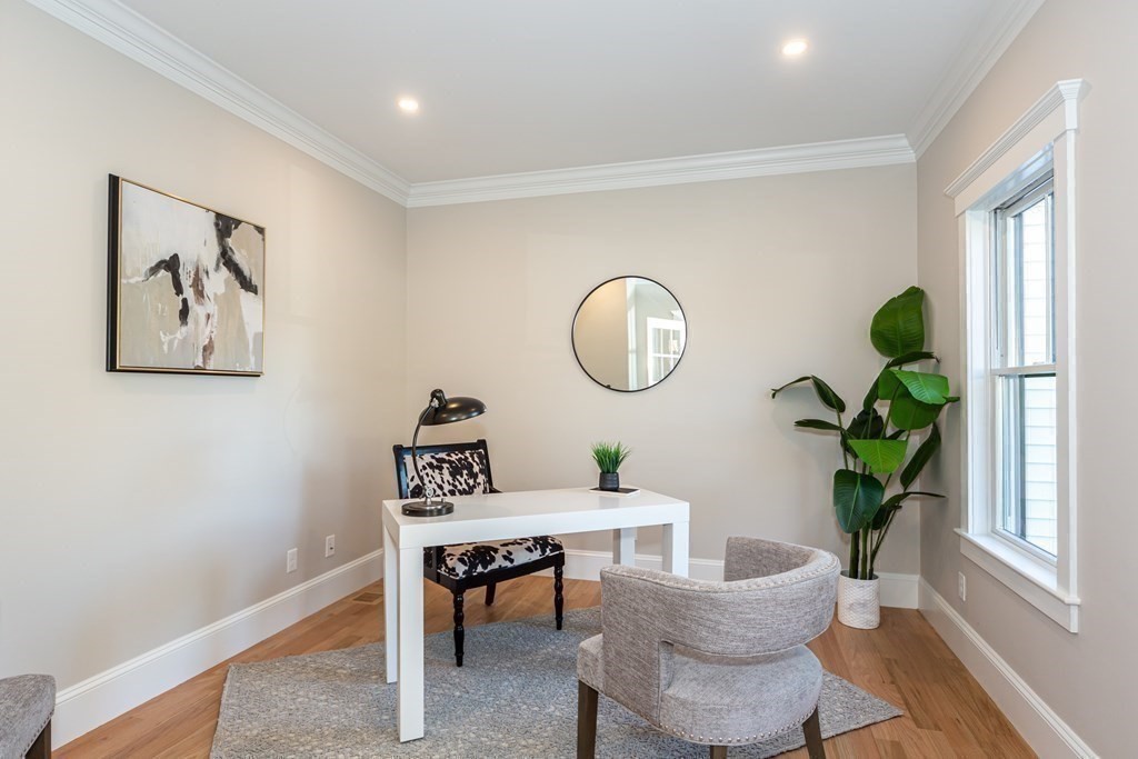 4 Whitcomb Street Natick, MA 01760 - Photo 12 of 42 a view of a livingroom with furniture a potted plant and wooden floor